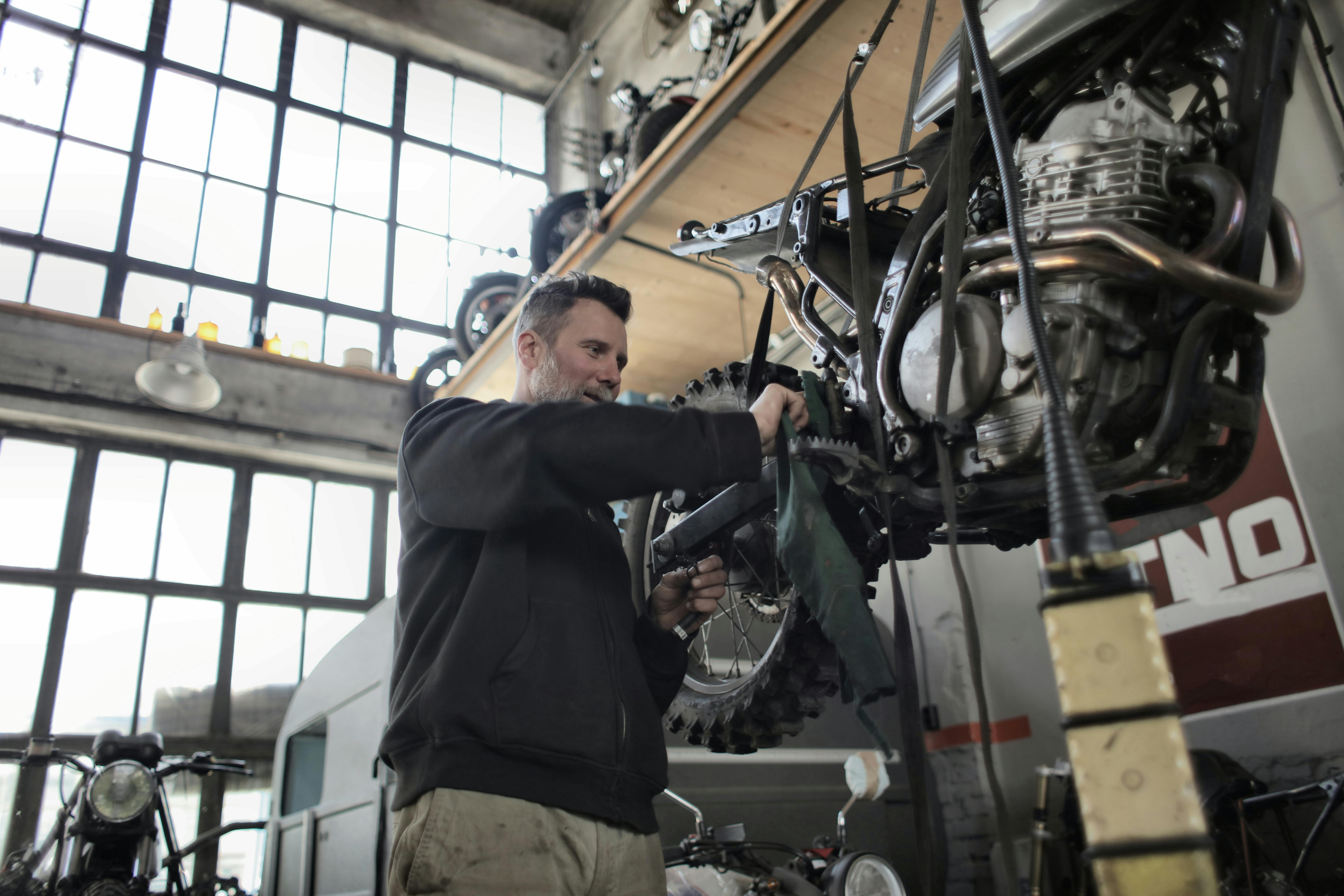 Mechanic servicing a motorcycle