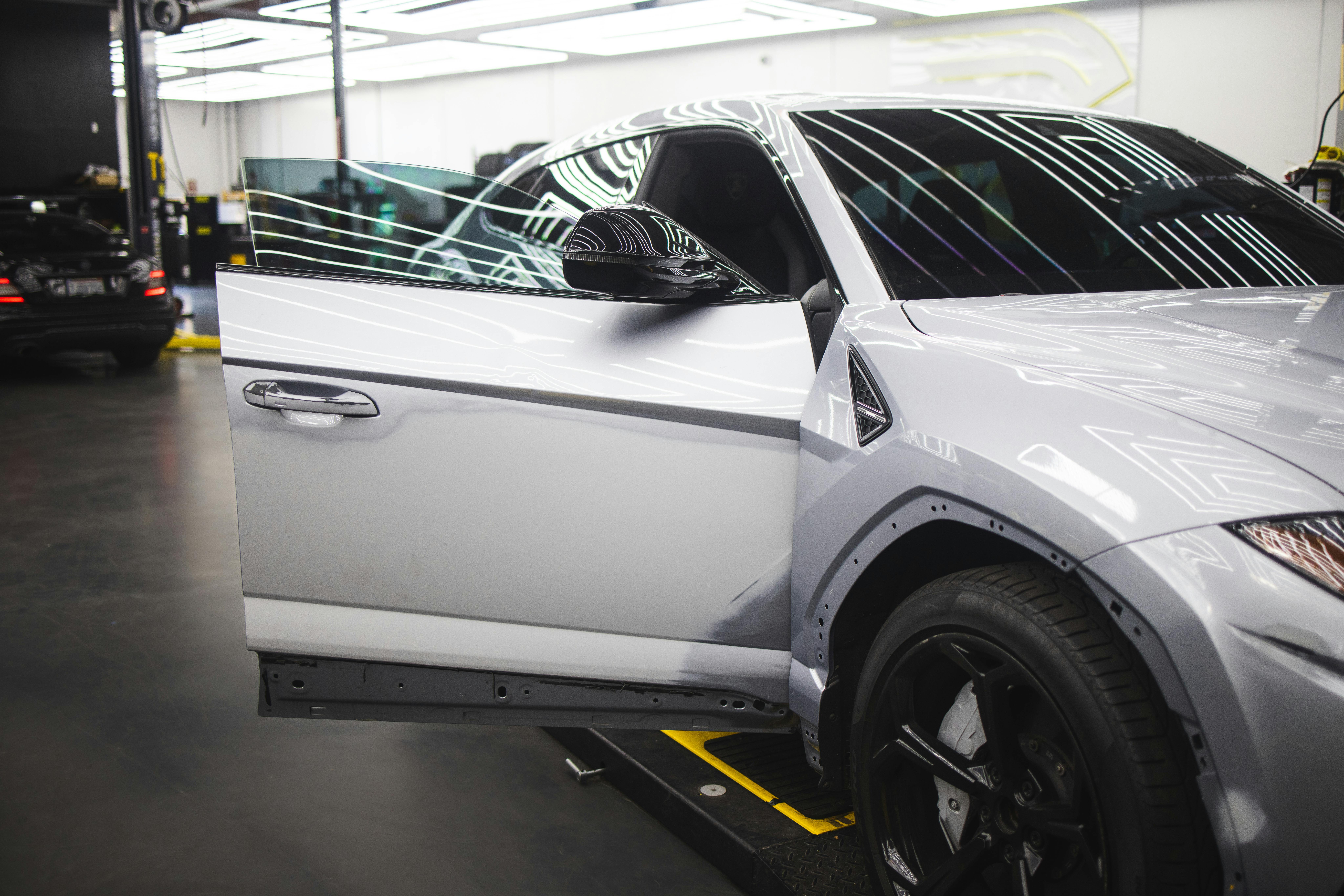 Vehicle bodywork being cleaned and finished