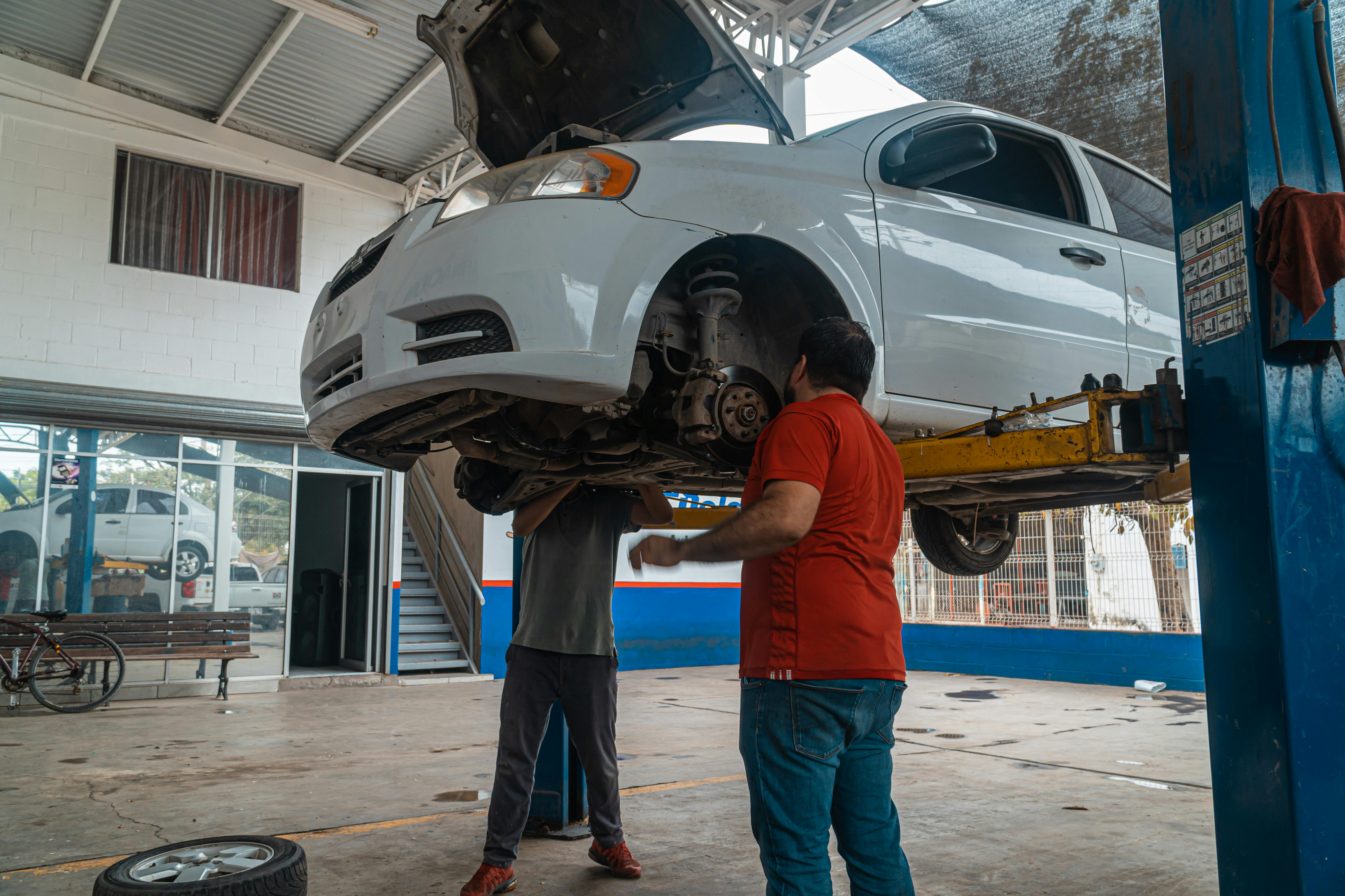 Car raised on a workshop service lift